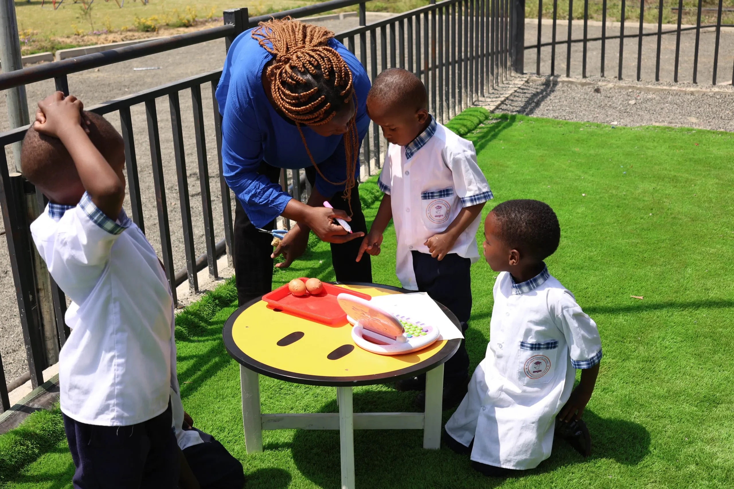 Students using hands-on Montessori learning materials at Kare Educational Centre